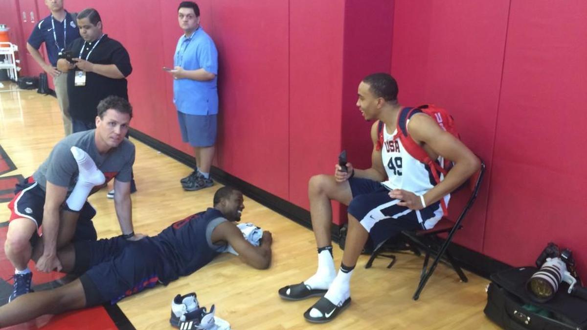 Former North Carolina forward Brice Johnson, right, shares a laugh with fellow Tar Heel star Harrison Barnes, on floor, after Monday's Team USA practice in Las Vegas.