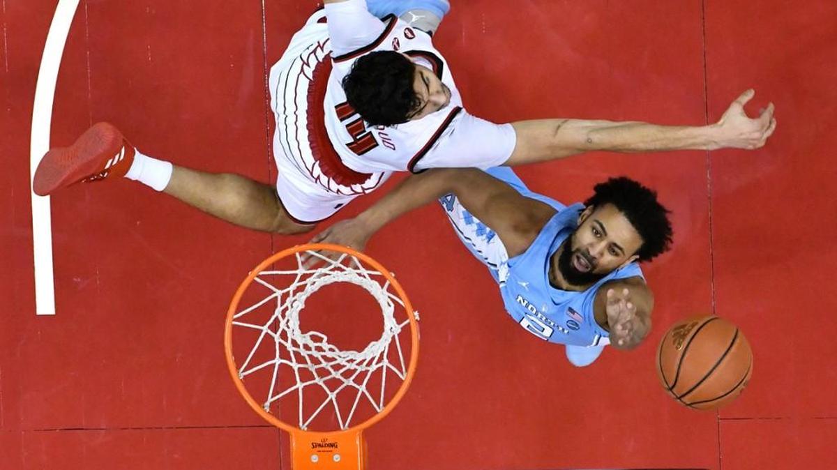 North Carolina guard Joel Berry II (2) shoots past the defense of Louisville forward Anas Mahmoud (14) during the first half.