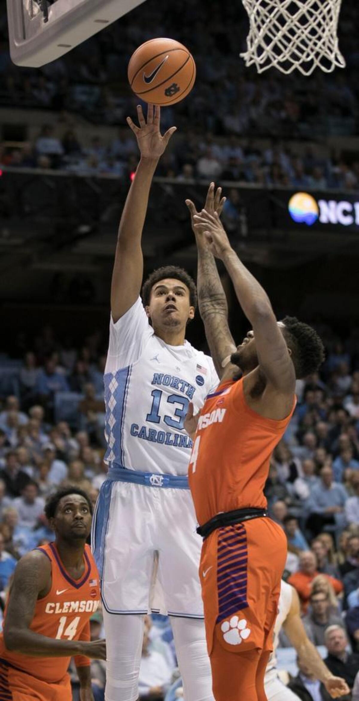 North Carolina’s Cameron Johnson (13) drives to the basket against Clemson’s Shelton Mitchell (4) during the first half on Tuesday, January 16, 2018 at the Smith Center in Chapel Hill, N.C.
