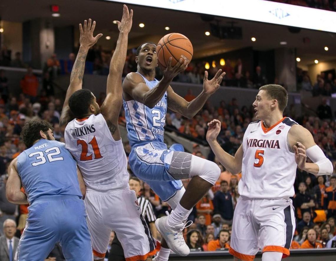 North Carolina’s Kenny Williams (24) break to the basket past Virginia’s Isaiah Wilkins (21) during the second half on Saturday, January 6, 2018 at John Paul Jones Arena in Charlottesville, Va.
