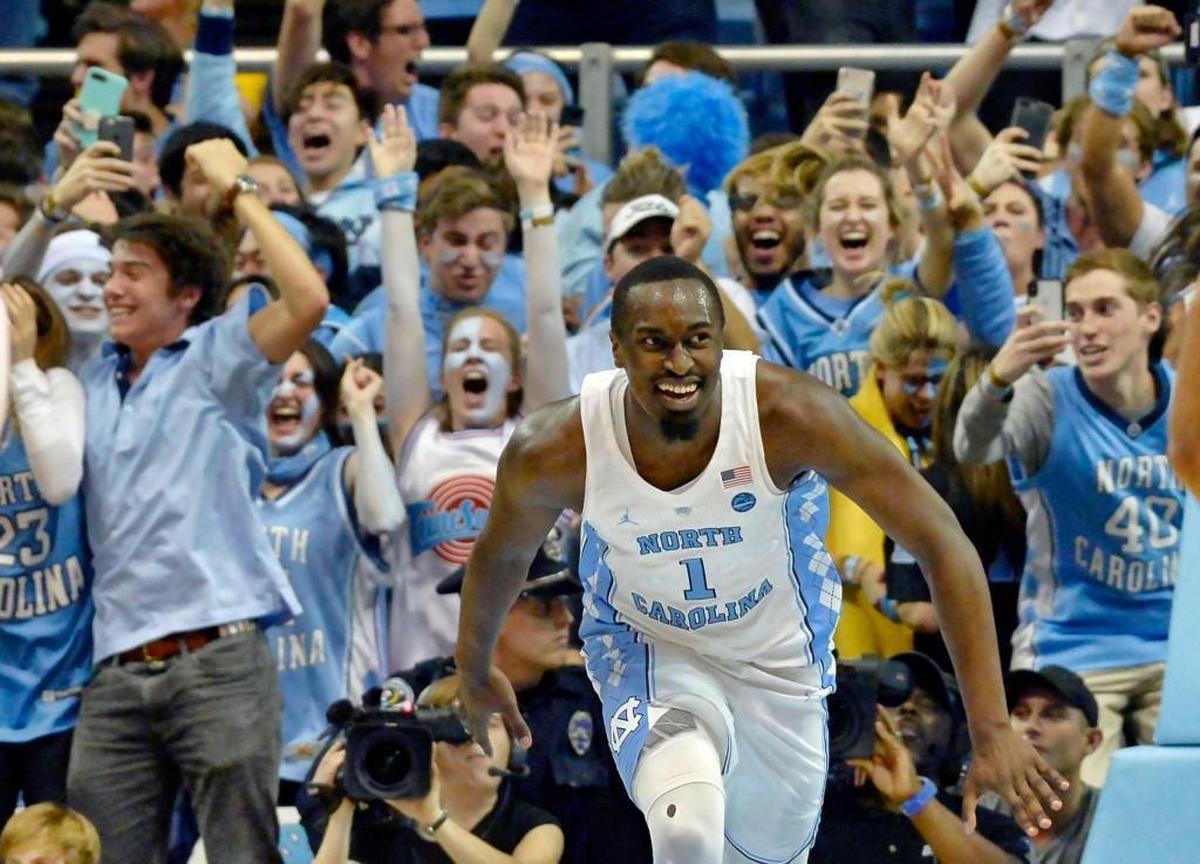 The Tar Heel faithful go wild as UNC forward Theo Pinson (1) slams home a final second dunk and UNC defeated Duke 82-78 at the Dean Smith Center in Chapel Hill, N.C. Thursday, Feb. 8, 2018.