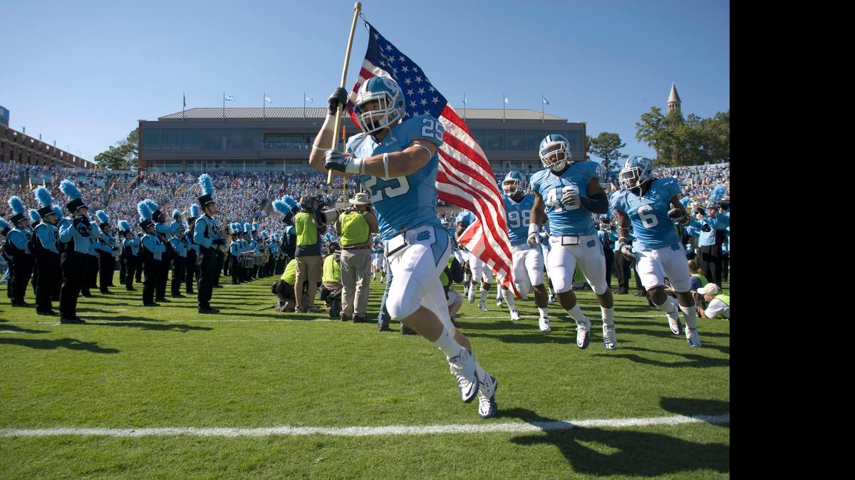 
UNC's Matt Merletti (25) leads the Tar Heels into Kenan Stadium for their game against East Carolina on Saturday October 2, 2010 in Chapel Hill, N.C. ROBERT WILLETT -robert.willett@newsobserver.com
