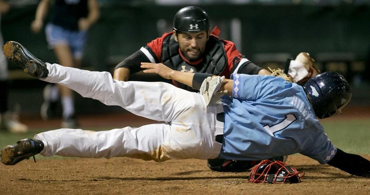 Davidson catcher Jake Sidwell (29) tags North Carolina’s Brandon Riley (1) out at home plate in the ninth inning to help secure the Wildcat’s 2-1 victory and clinch the NCAA regional on Sunday, June 4, 2017 at Boshamer Stadium in Chapel Hill, N.C.