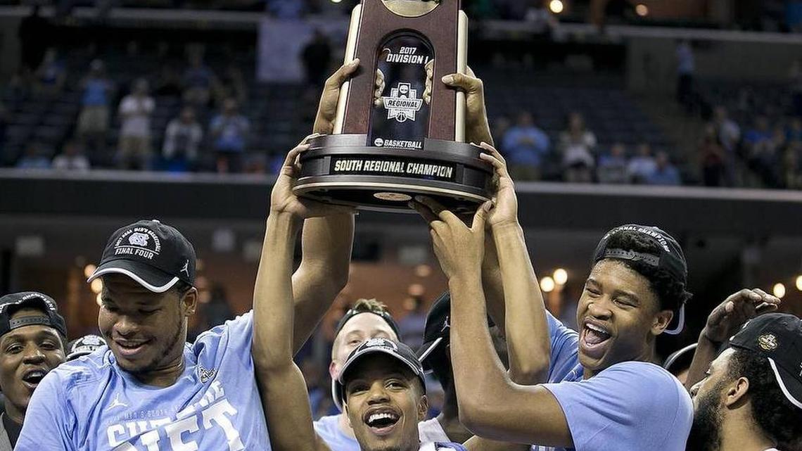 UNC seniors Kennedy Meeks, Nate Britt and Isaiah Hicks, seen here celebrating the Tar Heels’ South Regional championship have played together for four years -- a stretch in which no UNC player has transferred out of the program.