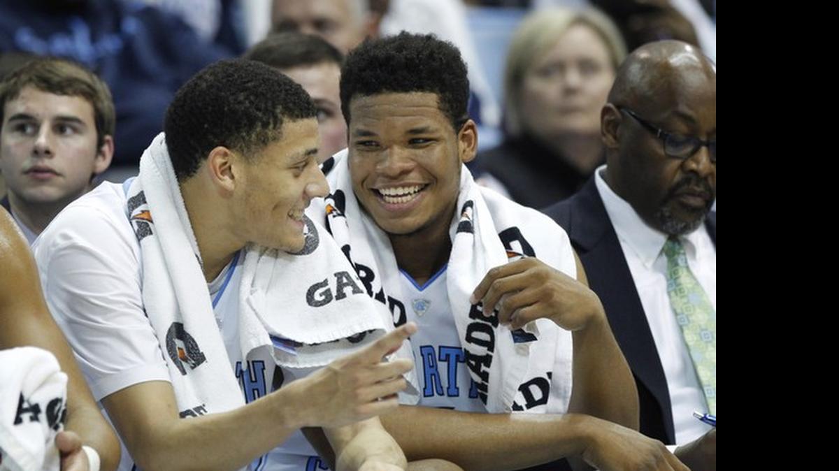 
Justin Jackson (left), Kennedy Meeks and the Tar Heels will play four non-conference games at neutral sites during the 2015-16 season.
