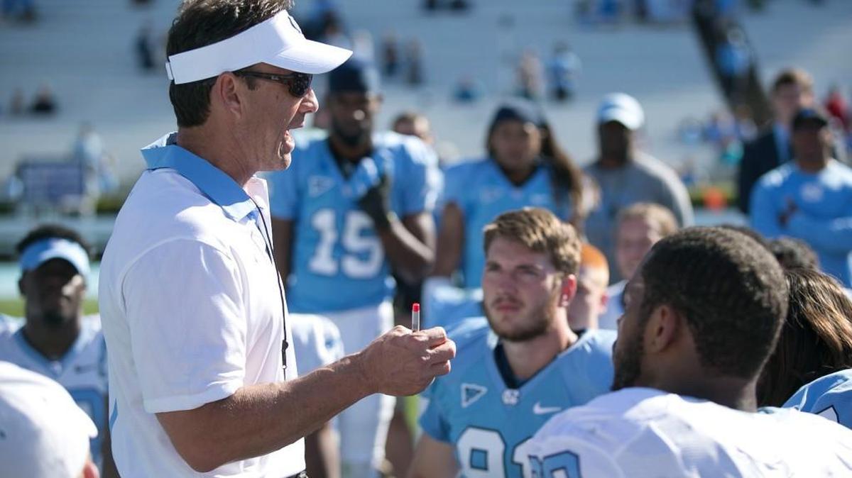 North Carolina coach Larry Fedora talks with his players following the Tar Heelsâ Spring Game on on Saturday April 16, 2016 at Kenan Stadium in Chapel Hill, N.C.