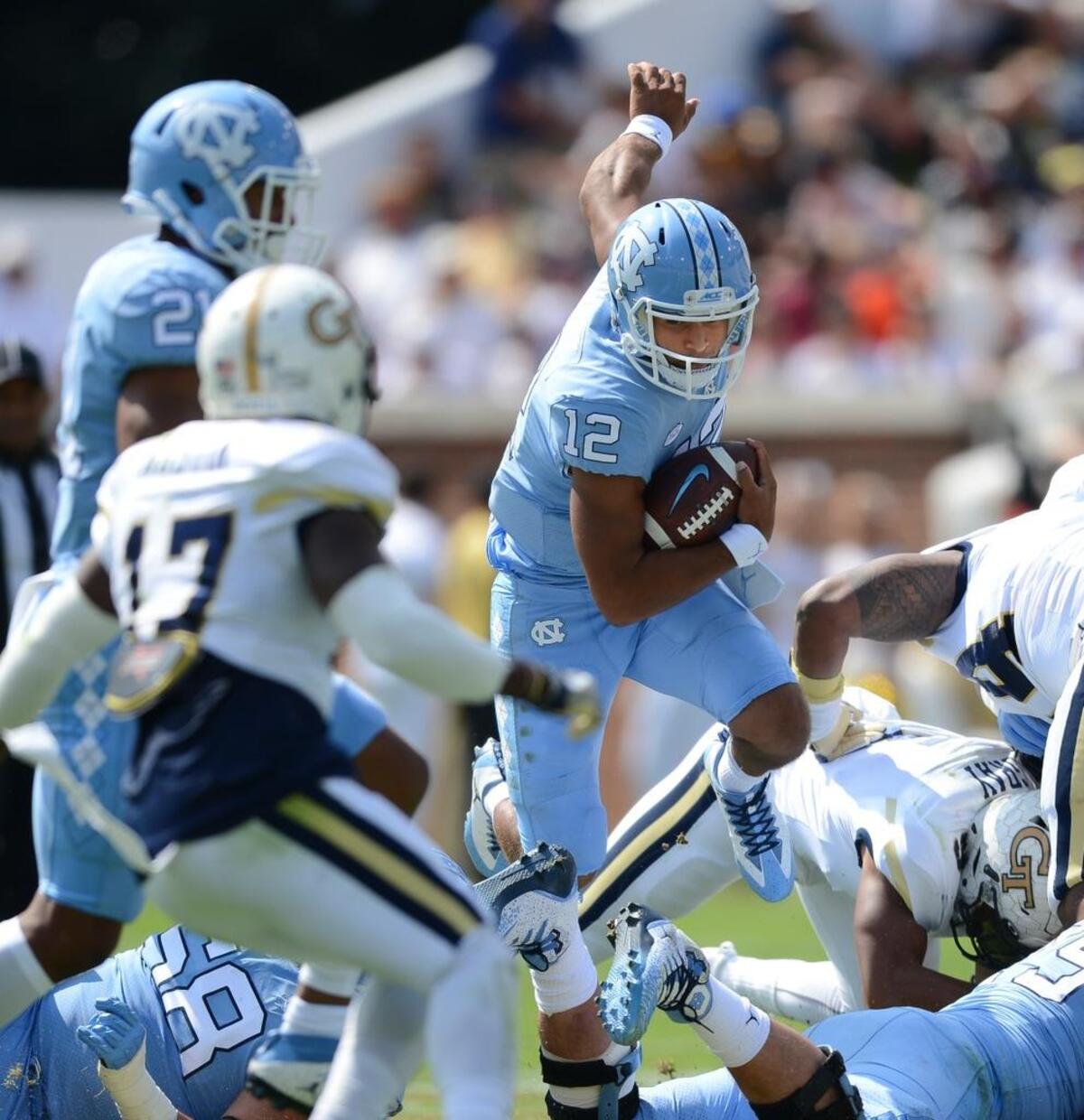 North Carolina quarterback Chazz Surratt (12) runs against Georgia Tech during the first half.