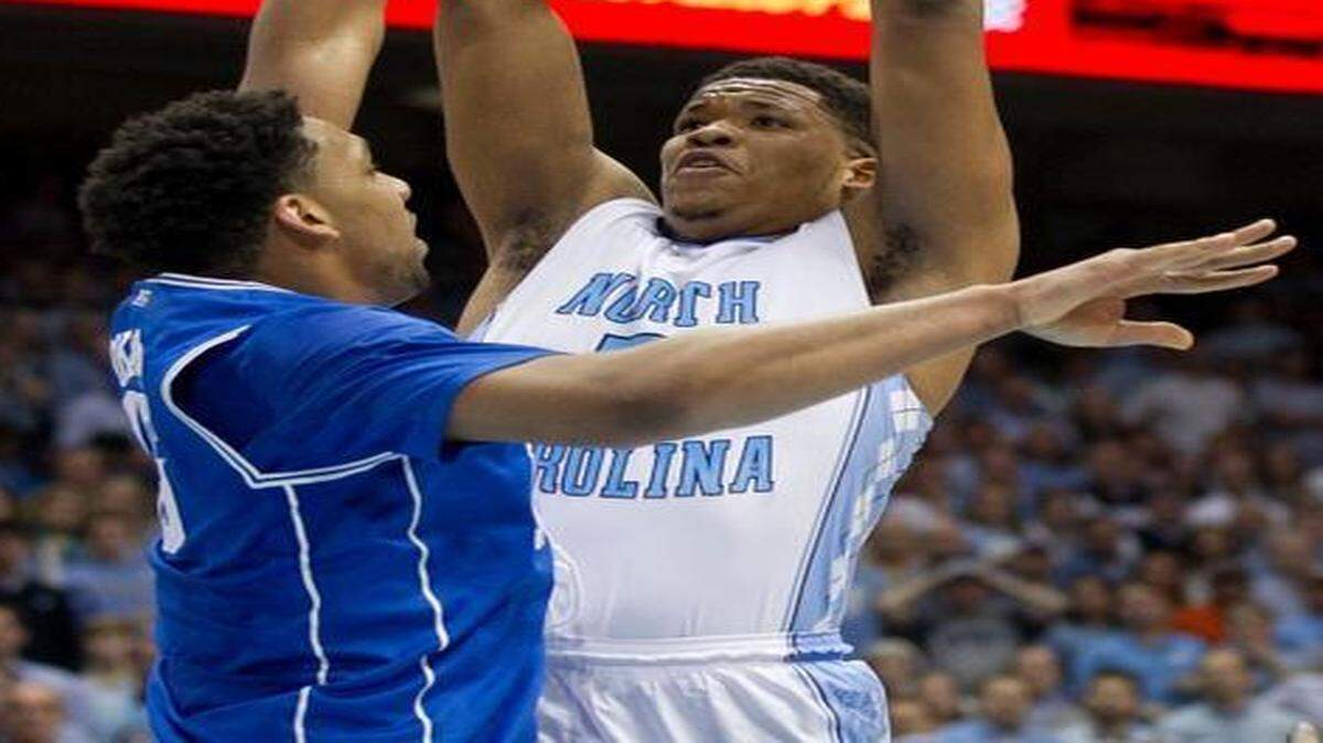 
Kennedy Meeks shoots over Duke’s Jahlil Okafor on Saturday.
