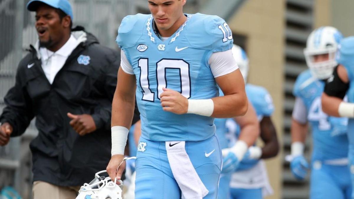 North Carolina quarterback Mitch Trubisky (10) and his teammates enter Bobby Dodd Stadium for the Tar Heels’ game against Georgia Tech.