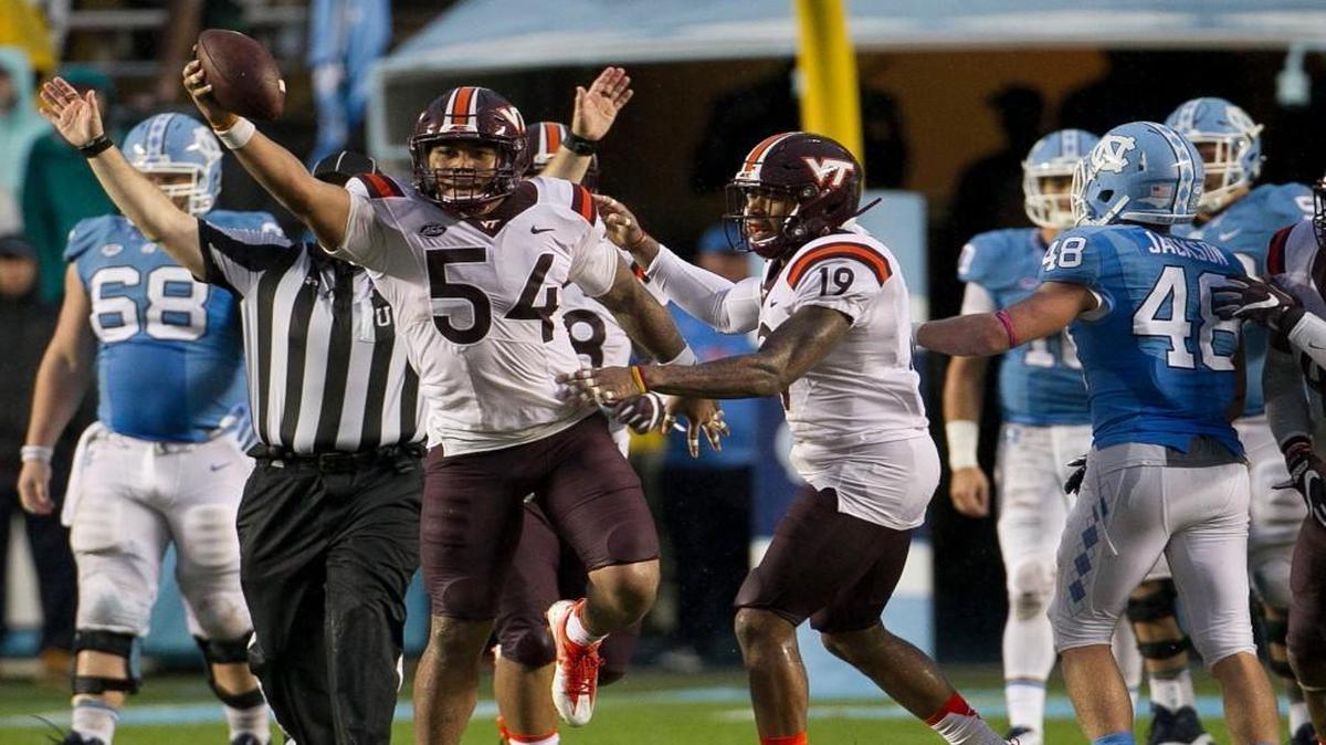 Virginia Tech’s Andrew Motuapuaka (54) celebrates after intercepting North Carolina quarterback Mitch Trubisky in the fourth quarter to seal the Hokies 34-3 victory at Kenan Stadium. It was Turbiskys first interception of the season.