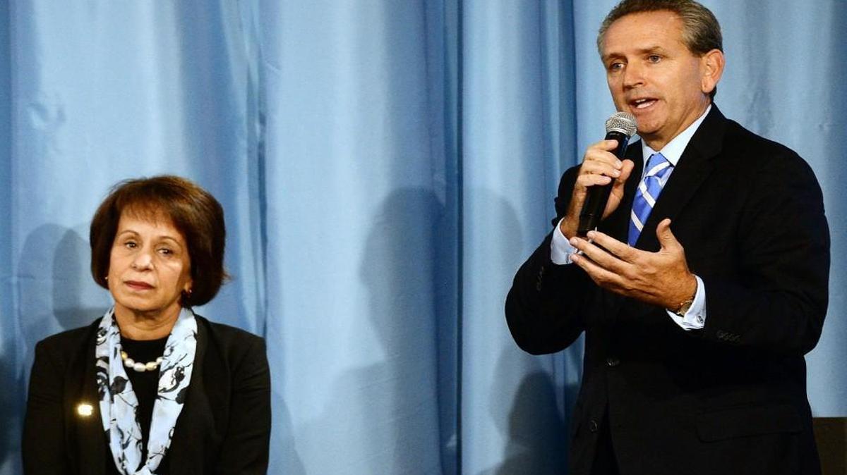 UNC Chancellor Carol L. Folt listens as athletic director Bubba Cunningham answers a question about future NCAA sanctions after a released report in October 2014.