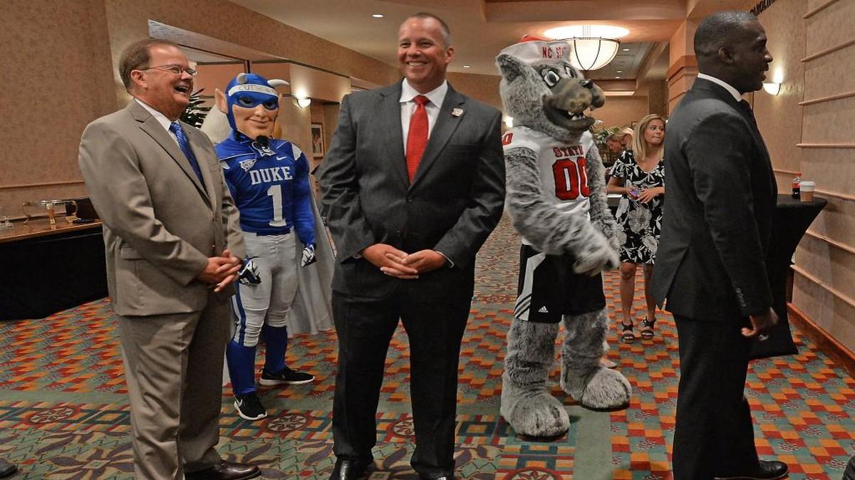 Coaches from the local D1 NCAA college football programs spoke at the 14th Annual Bill Dooley Pigskin Preview in Cary, N.C. Monday, July 18, 2016. Here waiting to be introduced to the audience are (left to right) Duke head coach David Cutcliffe, N.C. State head coach Dave Doeren and new East Carolina head coach, Scottie Montgomery.