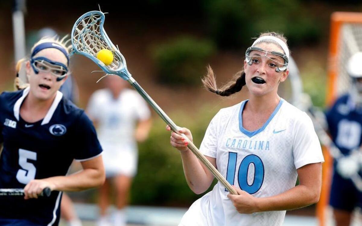 
North Carolina's Sydney Holman (10) controls the ball during the second half of UNC's 11-8 victory over Penn State in the NCAA women's college lacrosse quarterfinals at Fetzer Field in Chapel Hill.
