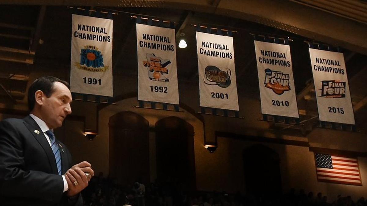 Duke head coach Mike Krzyzewski walks out to the court with the Blue Devils' National Championship banners in the background. Duke defeated Buffalo 82-59 at Cameron Indoor Stadium, Dec. 5, 2015 in Durham.