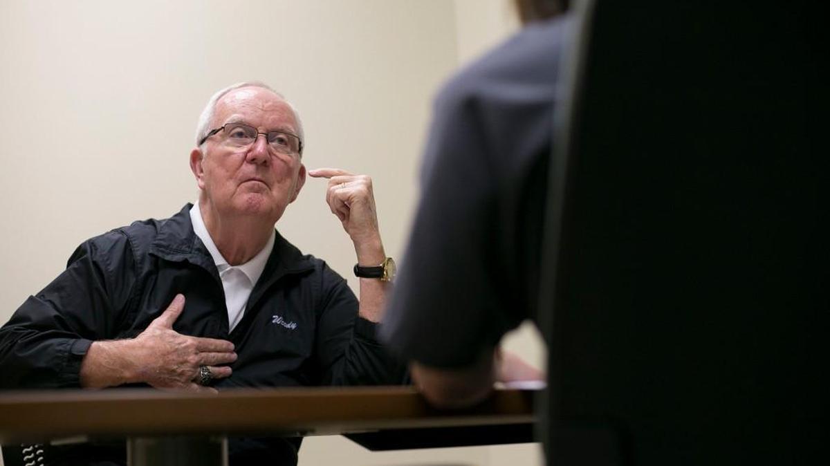 Woody Durham points to parts of his body during a visit to speech therapist Amber DePalma on Feb. 8, 2017, in Chapel Hill, N.C.