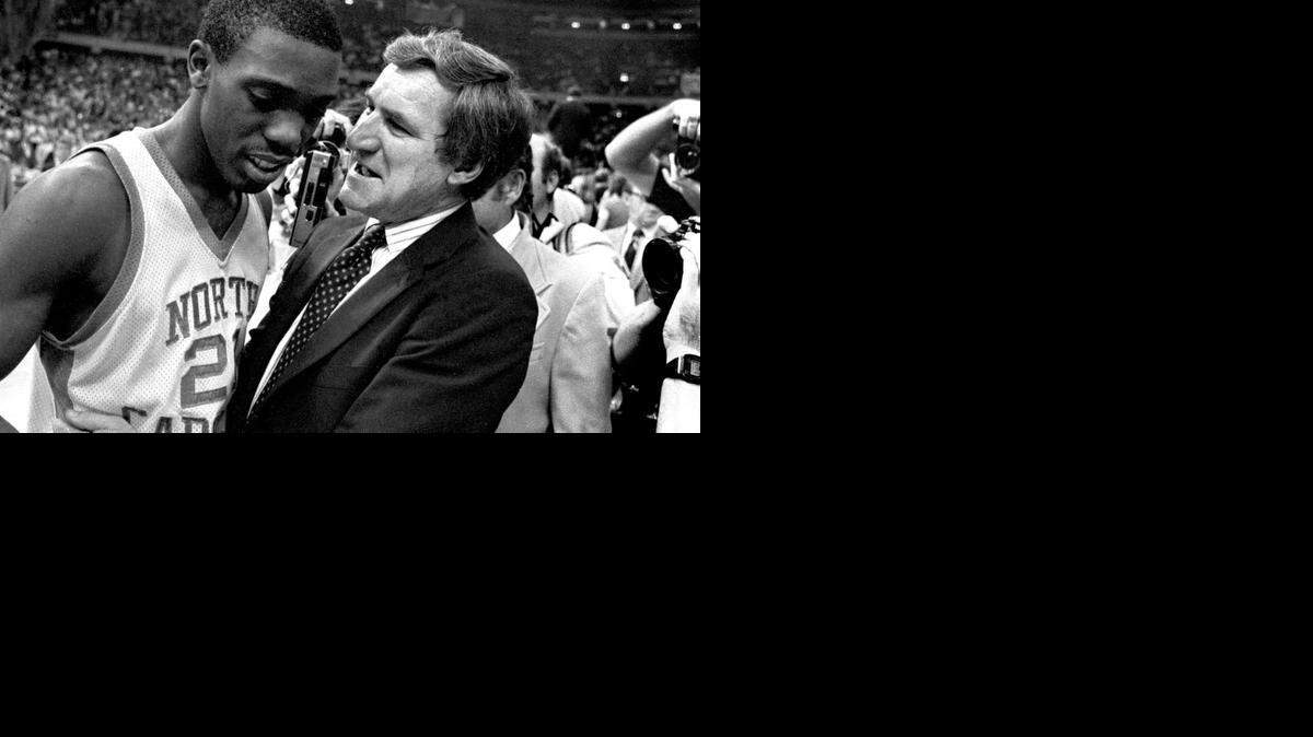 
UNC coach Dean Smith congratulates point guard Jimmy Black after the Tar Heels defeated the Georgetown Hoyas to win the 1982 National Championship in New Orleans, April 7, 1982.
