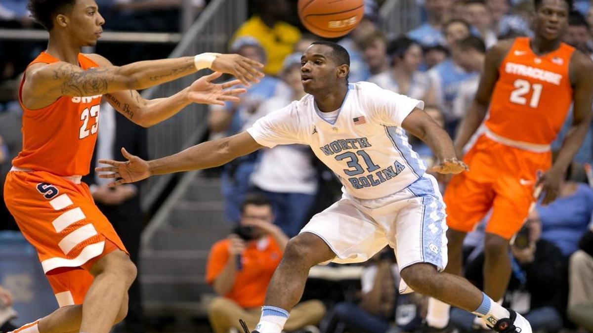 North Carolina senior Justin Coleman (31) guards Syracuse’s Malachi Richardson (23) on Feb. 29. Coleman, a graduate of Broughton, spent two years playing on UNC’s junior varsity team before earning a scholarship this season.