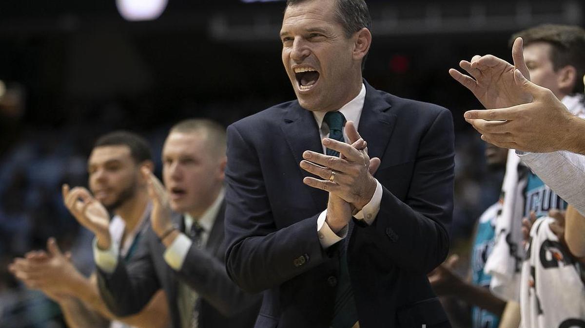 UNC Wilmington head coach C.B. McGrath applauds early first half play against North Carolina on Wednesday, December 5, 2018 at the Smith Center in Chapel Hill, N.C.