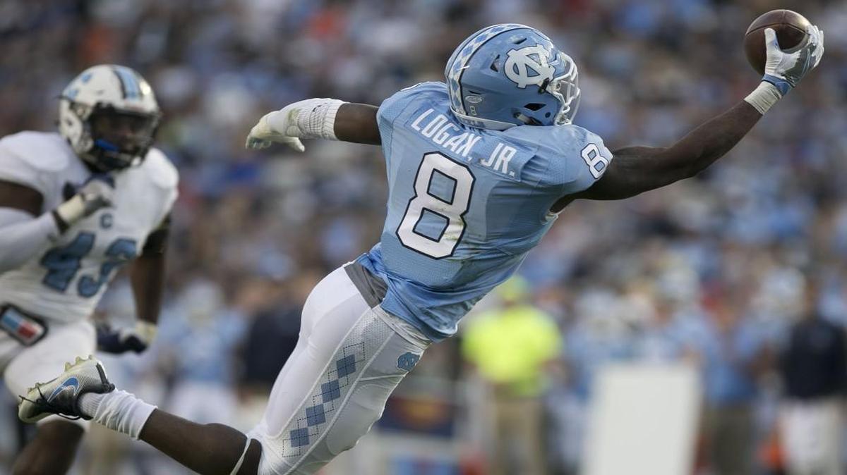 North Carolina’s T.J. Logan (8) makes a one-handed catch on a 23-yard pass from quarterback Mitch Trubisky for a touchdown ahead of The Citadel’s Tevin Floyd (43) in the second quarter.