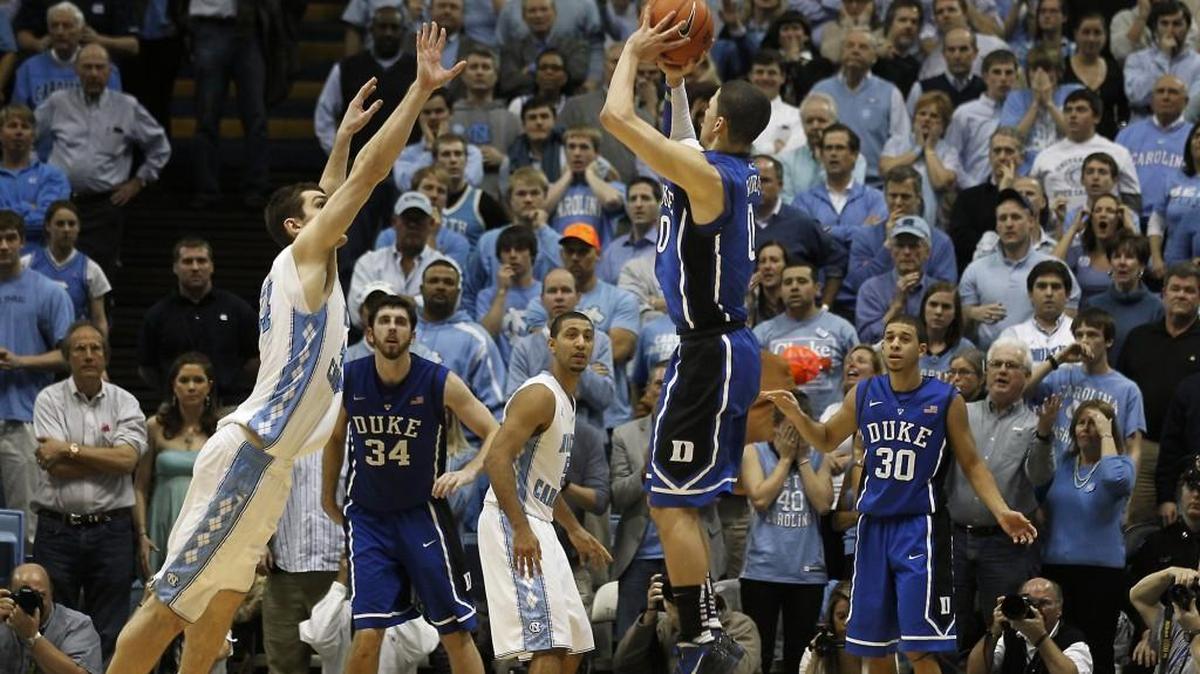 Duke guard Austin Rivers (0) launches a three pointer as UNC forward Tyler Zeller (44)attempts to defend to win the game 85-84. Duke battled UNC at the Smith Center in Chapel Hill, N.C. Wednesday, Feb. 8, 2012.