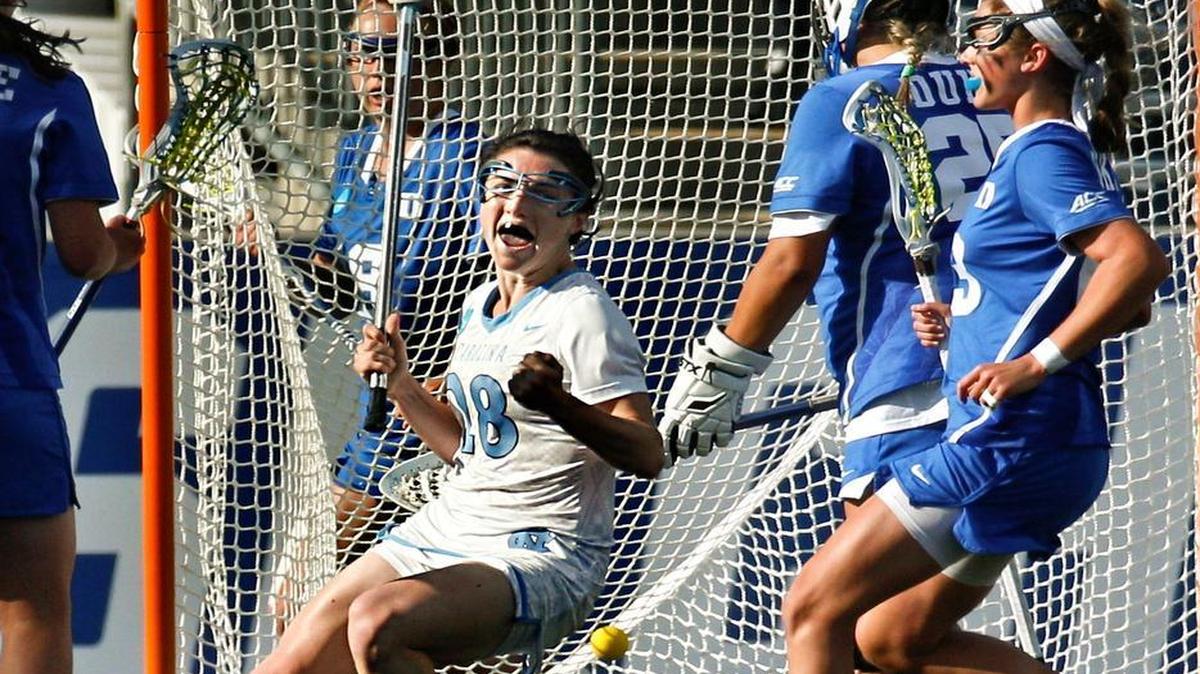 
North Carolina defender Courtney Waite, center, reacts to her goal on Duke goalie Kelsey Duryea, center right, during the first half of the semifinals in the NCAA Division I women’s lacrosse tournament Friday  in Chester, Pa. 
