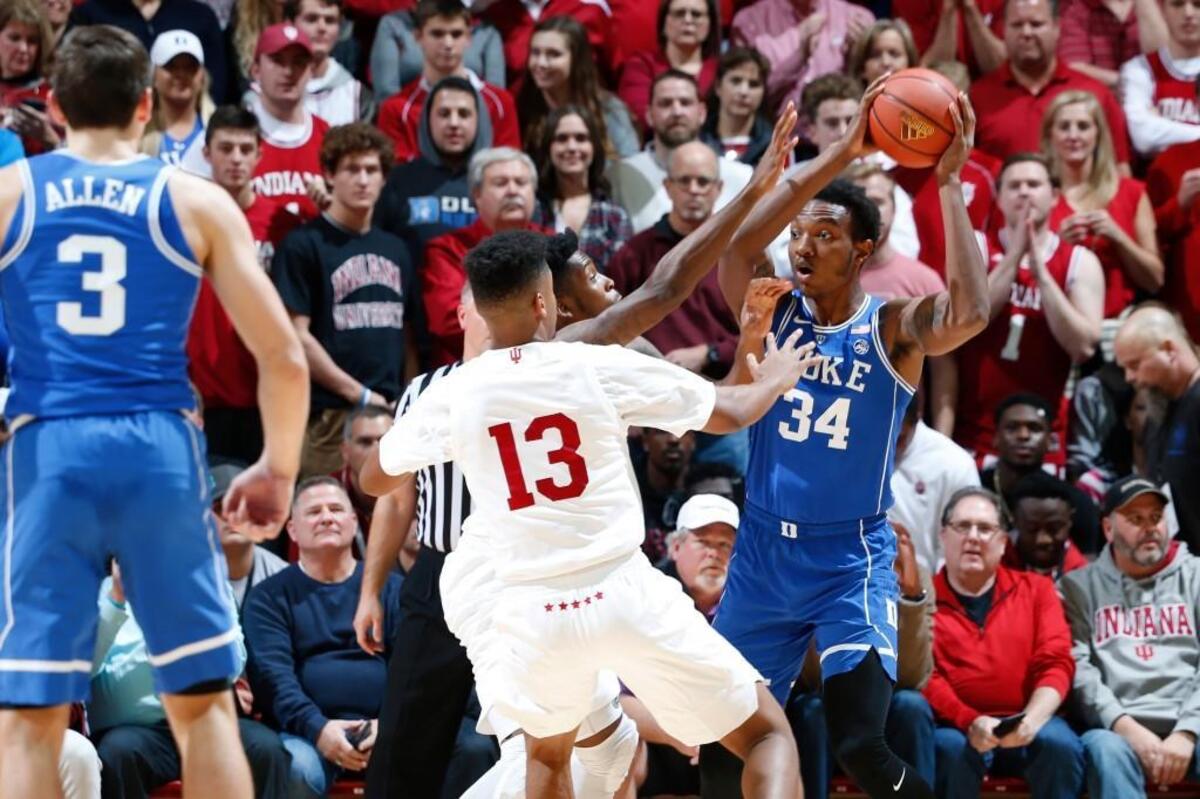 Duke’s Wendell Carter Jr., right, looks to pass the ball while defended by Indiana’s Juwan Morgan, middle, during the Big Ten-ACC Challenge on Nov. 29.