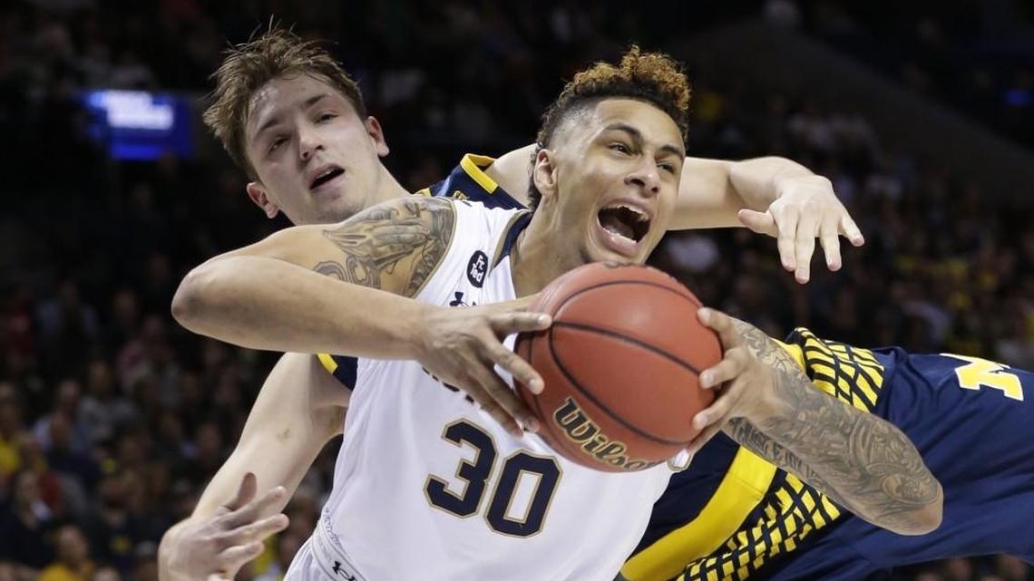 Notre Dame's Zach Auguste (30) is fouled by Michigan's Mark Donnal during the Fighting Irish’s win NCAA tournament win on March 18.