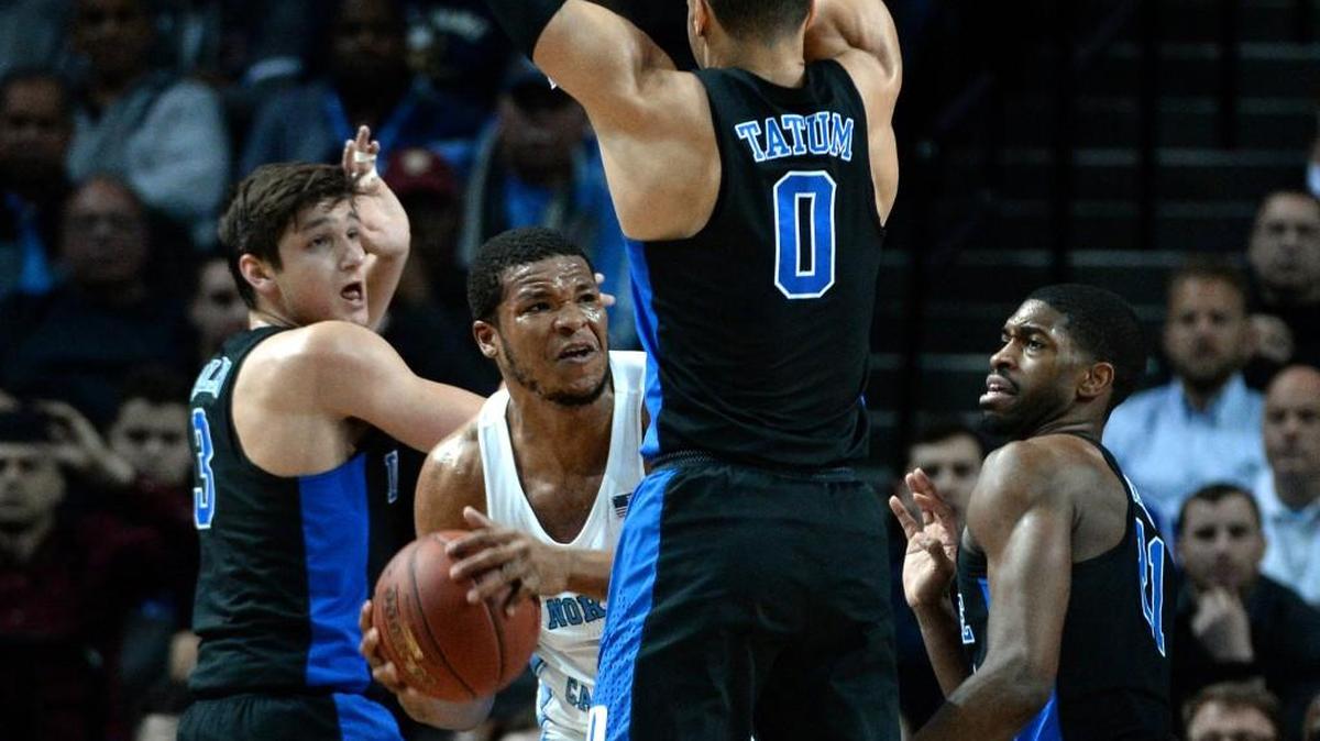 UNC forward Kennedy Meeks (3) is surrounded by Duke guard Grayson Allen (3), forward Jayson Tatum (0) and forward Amile Jefferson (21). Could Duke and UNC play for the national title?