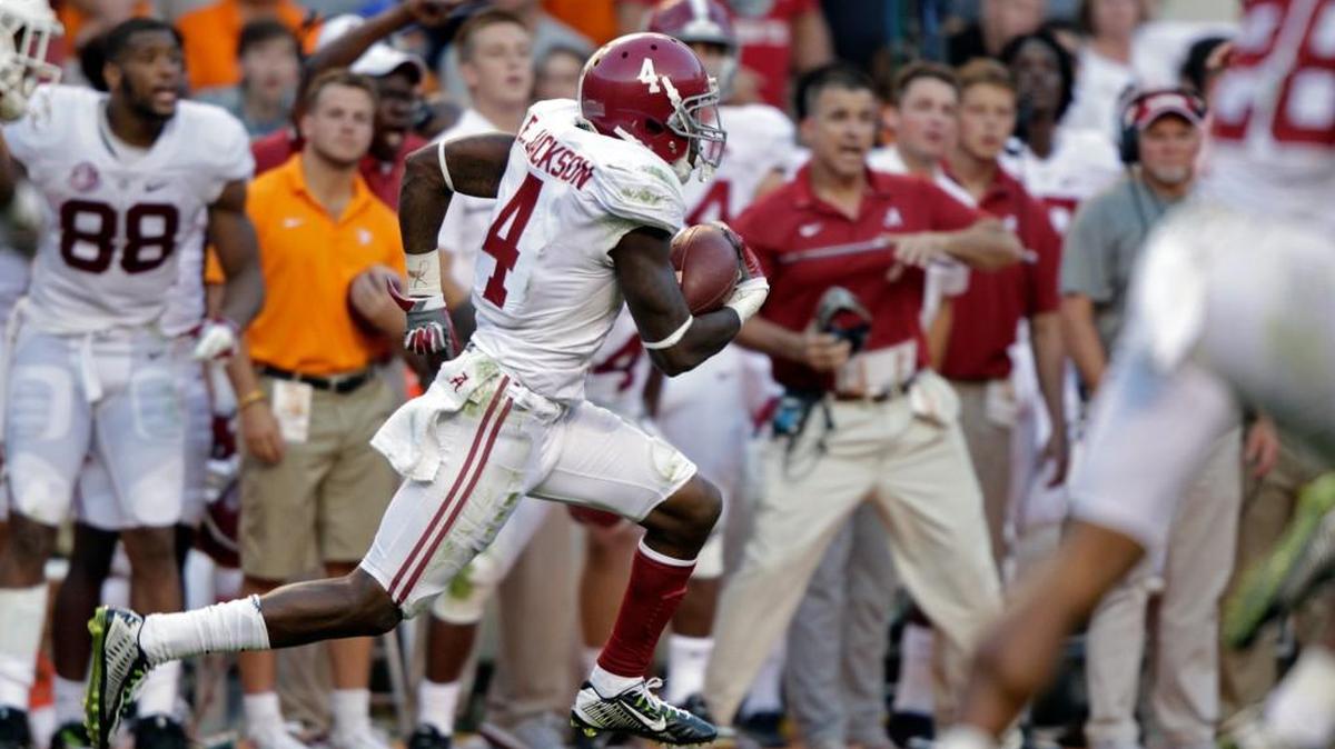 Alabama defensive back Eddie Jackson (4) returns a punt for a 79-yard touchdown against Tennessee in Knoxville, Tenn., on Oct. 15. (AP Photo/Wade Payne, File)