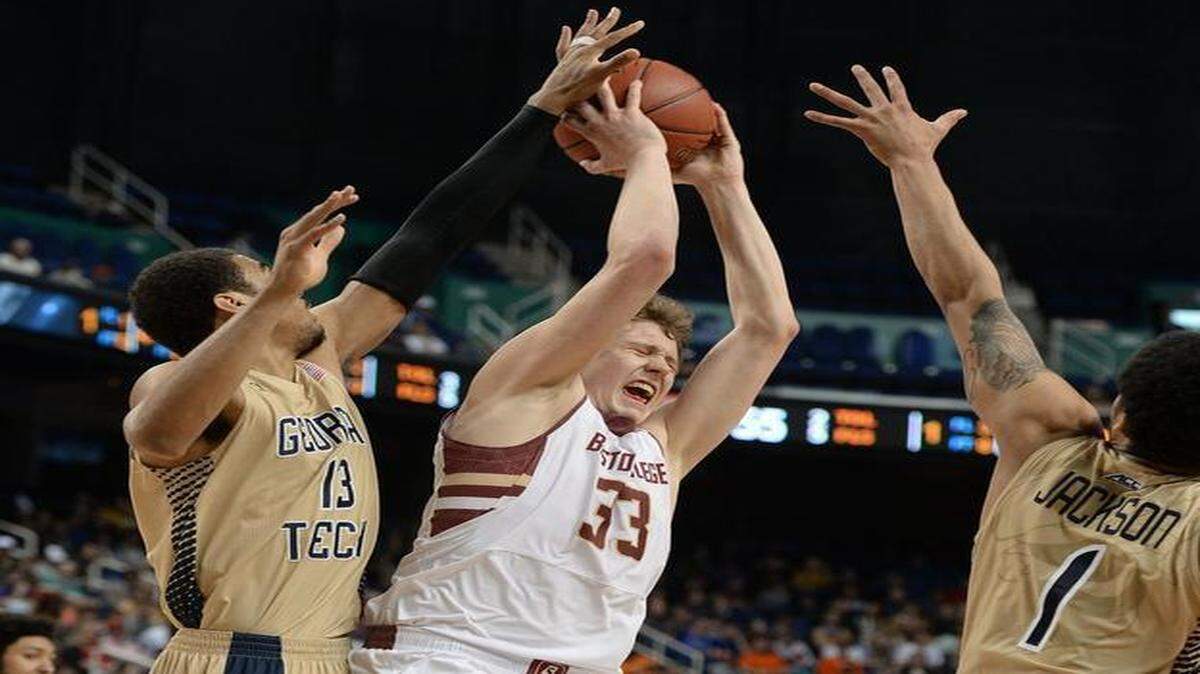 
Boston College guard Patrick Heckmann (33) looks for hall as Georgia Tech forward Robert Sampson (13) and guard Tadric Jackson (1) defend the post. Boston College beat Georgia Tech 66-65 during opening game of the ACC Tournament at the Greensboro Coliseum in Greensboro, NC Tuesday, March 10, 2015.
