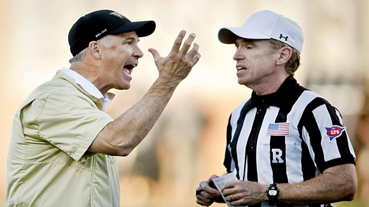 
Wake Forest head coach Dave Clawson argues with referee Pat Garvey after a flag was thrown during the second half of an NCAA college football game against Boston College in Winston-Salem,  Oct. 25, 2014. 
