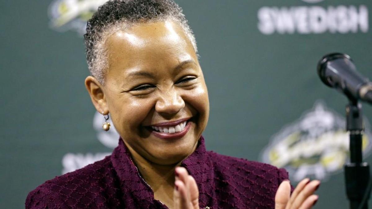 WNBA president Lisa Borders applauds at a Seattle Storm news conference April 21 in Seattle. (AP Photo/Elaine Thompson)