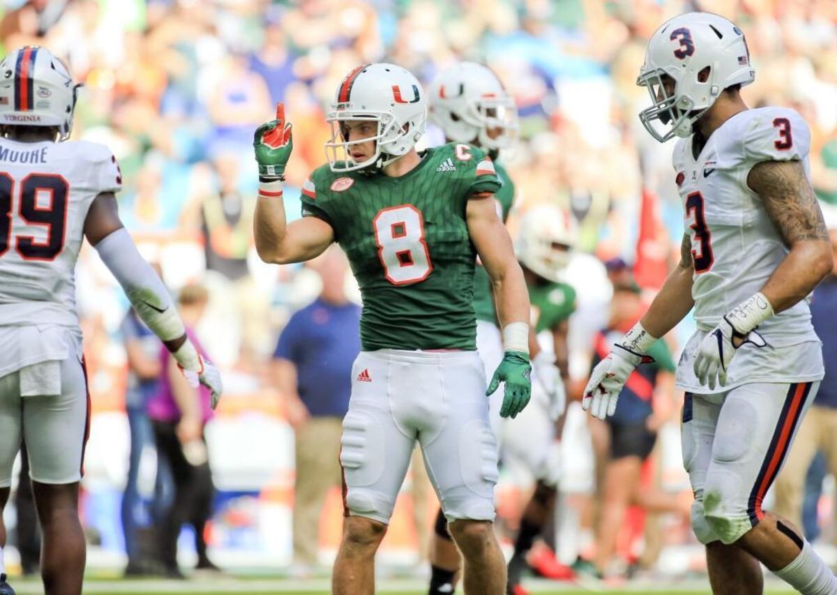 Miami Hurricanes wide receiver Braxton Berrios (8) signals a first down in the third quarter the University of Miami Hurricanes host the Virginia Cavaliers at Hard Rock Stadium on November 18, 2017.