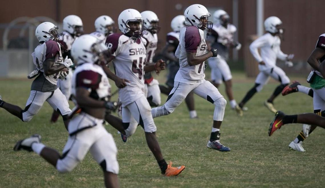 Shaw players run sprints during practice in this August 2016 file photo.