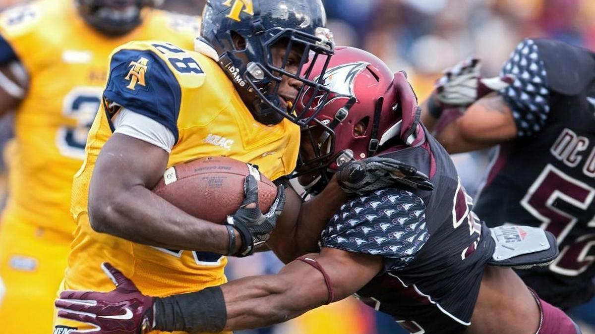 N.C. Central’s Alden McClellon, right, tackles North Carolina A&T’s Tarik Cohen in the Eagles’ 42-21 win in 2016.
