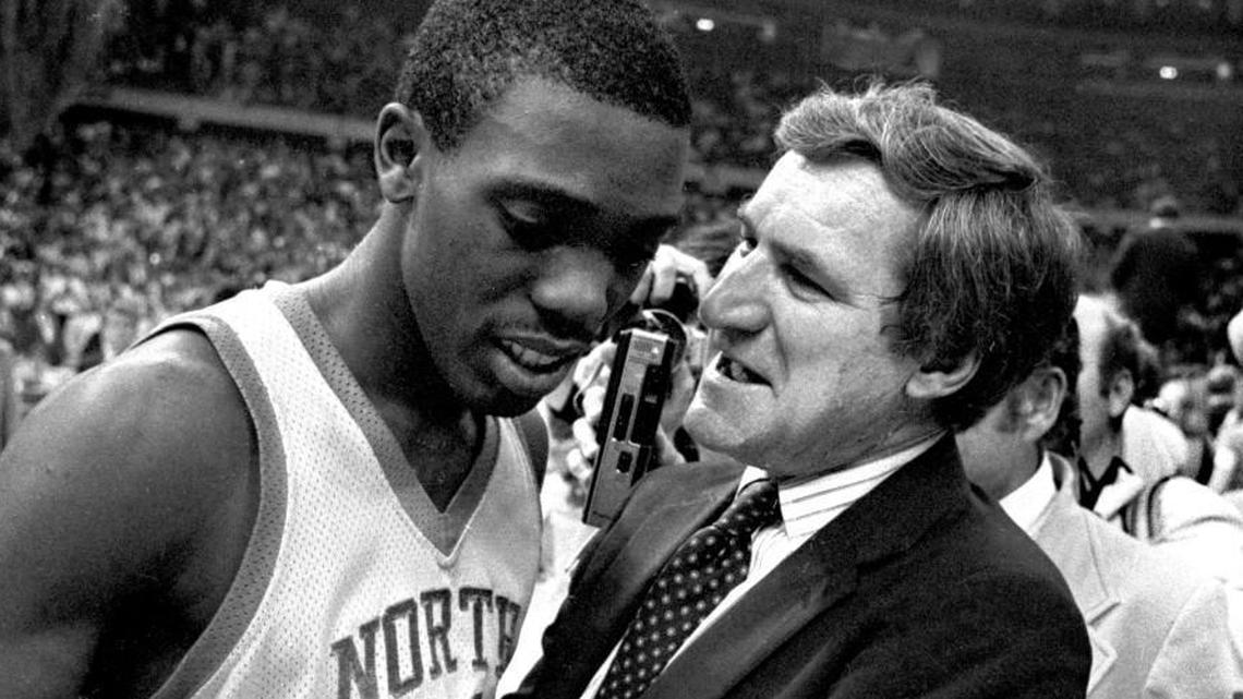 UNC coach Dean Smith congratulates point guard Jimmy Black after the Tar Heels defeated the Georgetown Hoyas to win the 1982 National Championship in New Orleans, April 7, 1982.
