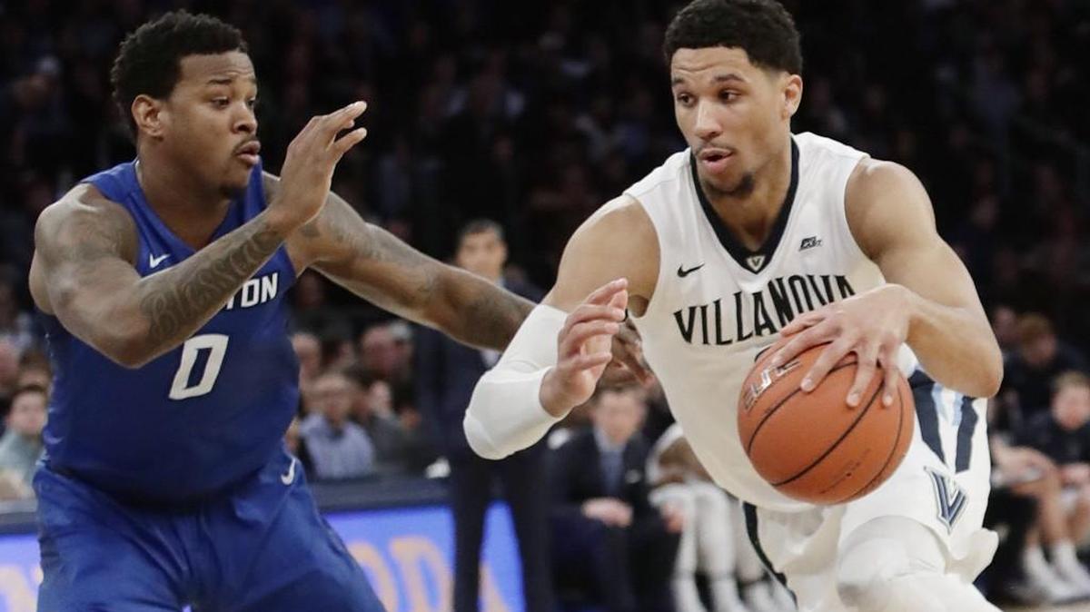 Villanova’s Josh Hart drives past Creighton’s Marcus Foster during the Big East tournament final Saturday in New York.