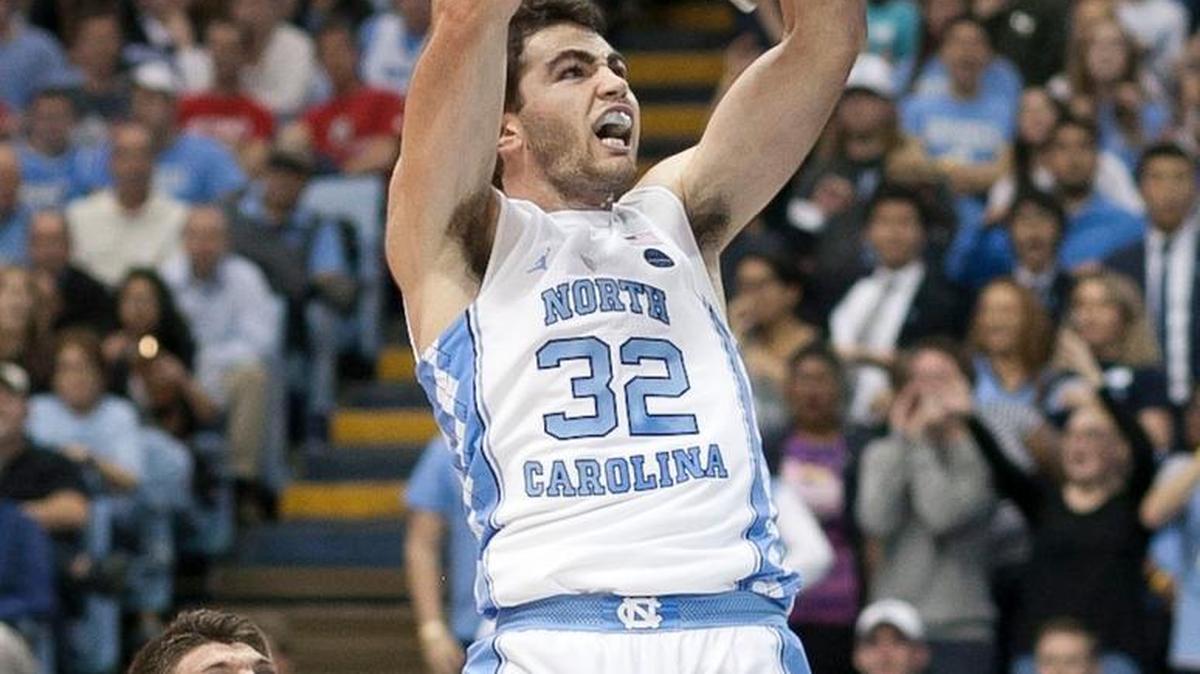 North Carolina’s Luke Maye dunks over Davidson’s Andrew McAuliffe on Dec. 7. Maye had 10 points in the first half.