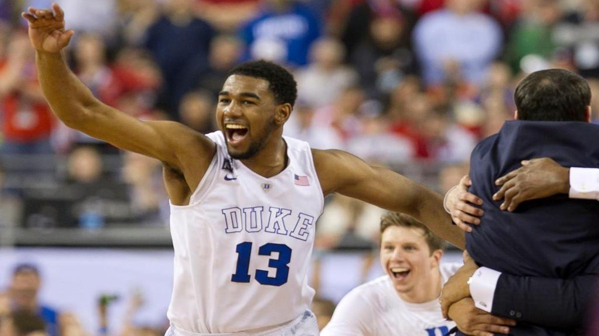Duke’s Matt Jones (13) and the Blue Devil bench erupt as time expires and they celebrate their 68-63 victory over Wisconsin in the NCAA championship game on Monday April 6, 2015 in Indianapolis, Indiana.