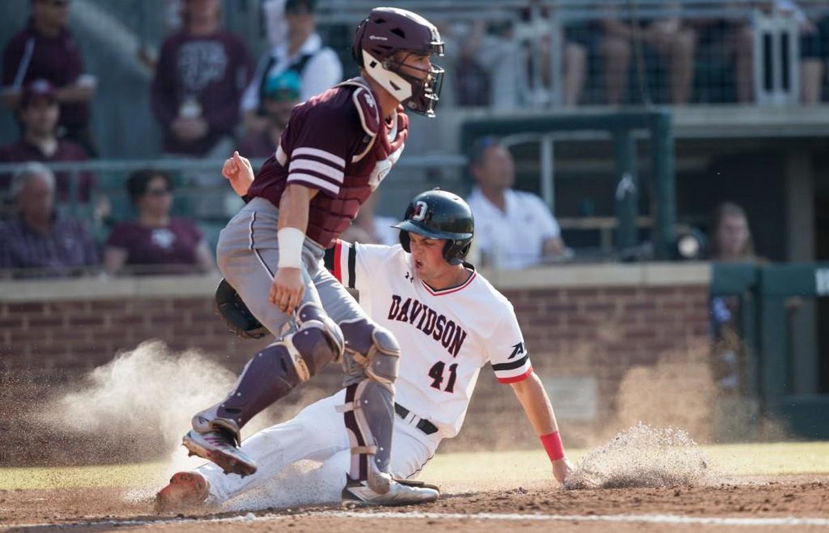 Davidson’s Will Robertson slides safely into home during Saturday’s third inning of a super regional game against Texas A&M in College Station, Texas.
