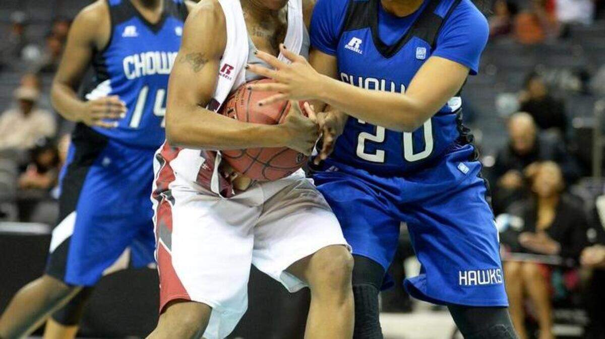 Shaw’s Kaula Jacks (10) and Chowan’s Elisia Diggs (20) fight for a rebound during the Chowan vs. Shaw CIAA women's tournament semifinals at Time Warner Cable Arena. Shaw won 86-77.