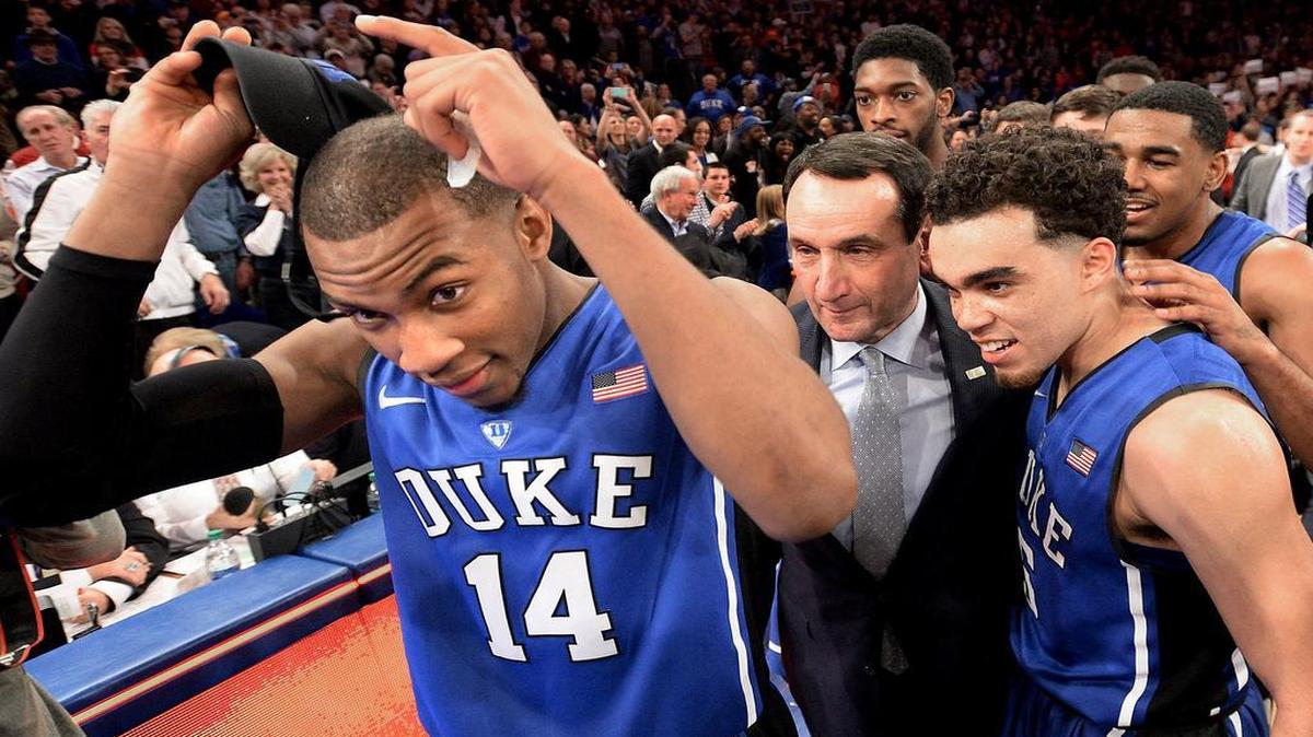 
Duke head coach Mike Krzyzewski is surrounded by his players after Duke beat St. John's 77-68 at New York’s Madison Square Garden on Sunday, Jan. 25, 2015. It was Krzyzewski’s 1,000th career win and one of the last times guard Rasheed Sulaimon wore a Blue Devils uniform. Sulaimon is now with the Maryland Terrapins.
