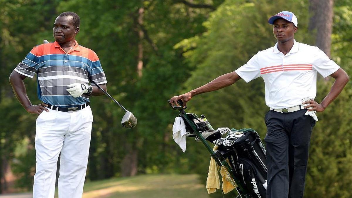 
Stephen Klah, left, and Vincent Torgah, of Ghana, wait to tee off at the U.S. Open local qualifying which took place at the Duke University Golf Club in Durham Tuesday, May 12, 2015.
