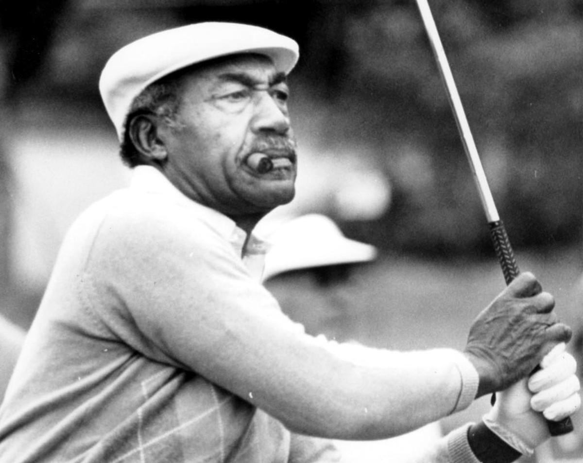 Charles Sifford plays during the Johnny Mathis Senior golf tournament at MountainGate in March 1986. Sifford died Tuesday, Feb. 3, 2015. He was 92.