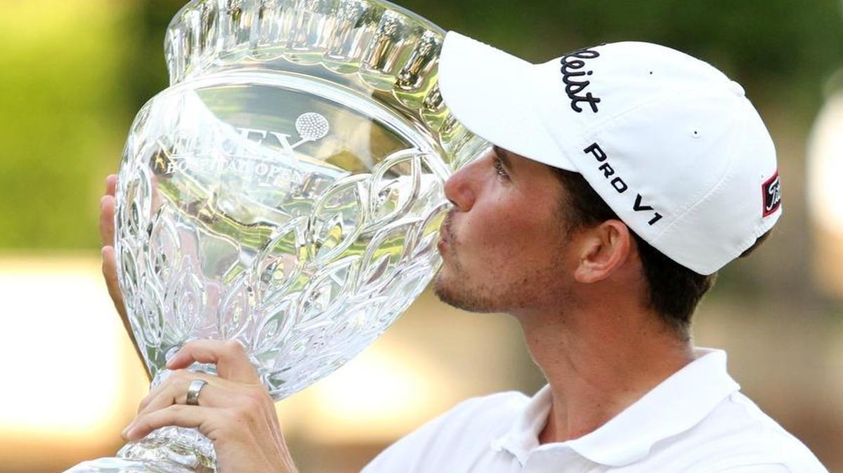 
Chesson Hadley kisses his hardware after winning the Rex Hospital Open in 2013 at TPC Wakefield Plantation.
