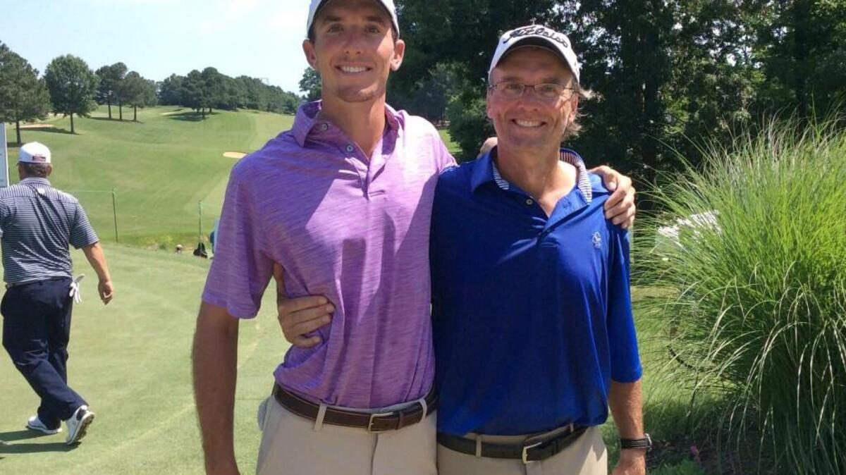 Carter Jenkins, left, and father Bobby share a moment Saturday, June 3, 2017, after third round of Rex Hospital Open.
