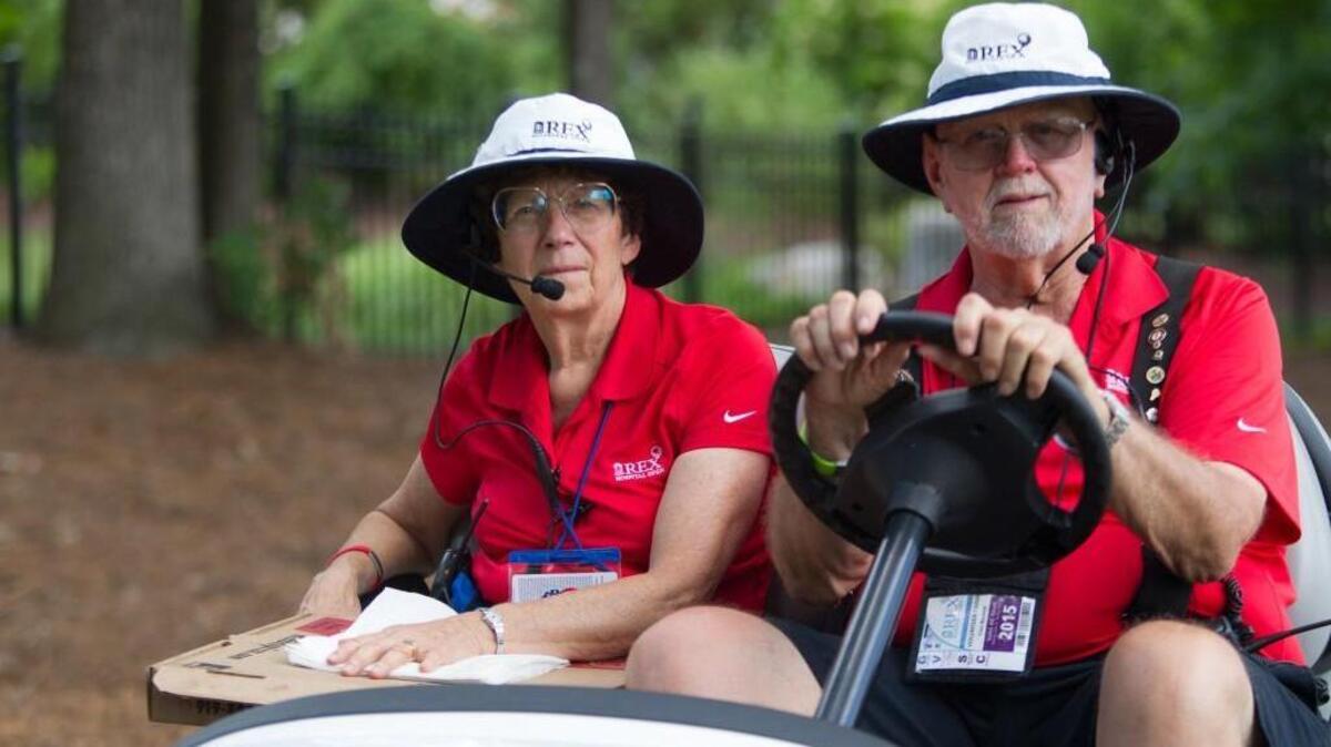 Rex Open golf volunteers Lucy and Curt and Barnhill.