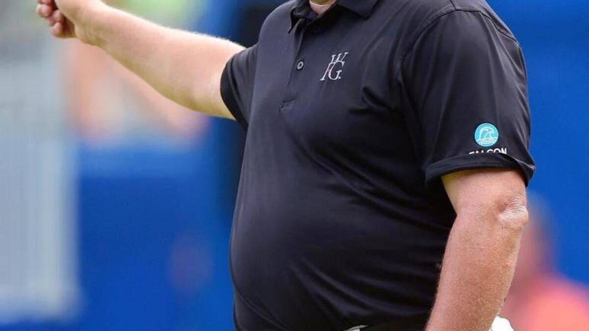 Jason Gore waves to the gallery after making his birdie putt on the 18th green during the third round of the Wyndham Championship at Sedgefield Country Club on August 22, 2015 in Greensboro. (Photo by Jared C. Tilton/Getty Images)