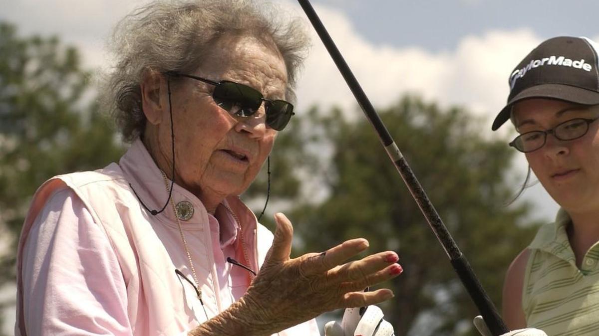 Peggy Kirk Bell, left, shows Dana Ogrin, 15, right, how to hold the golf club at Pine Needles Lodge and Golf Club in June 2007.