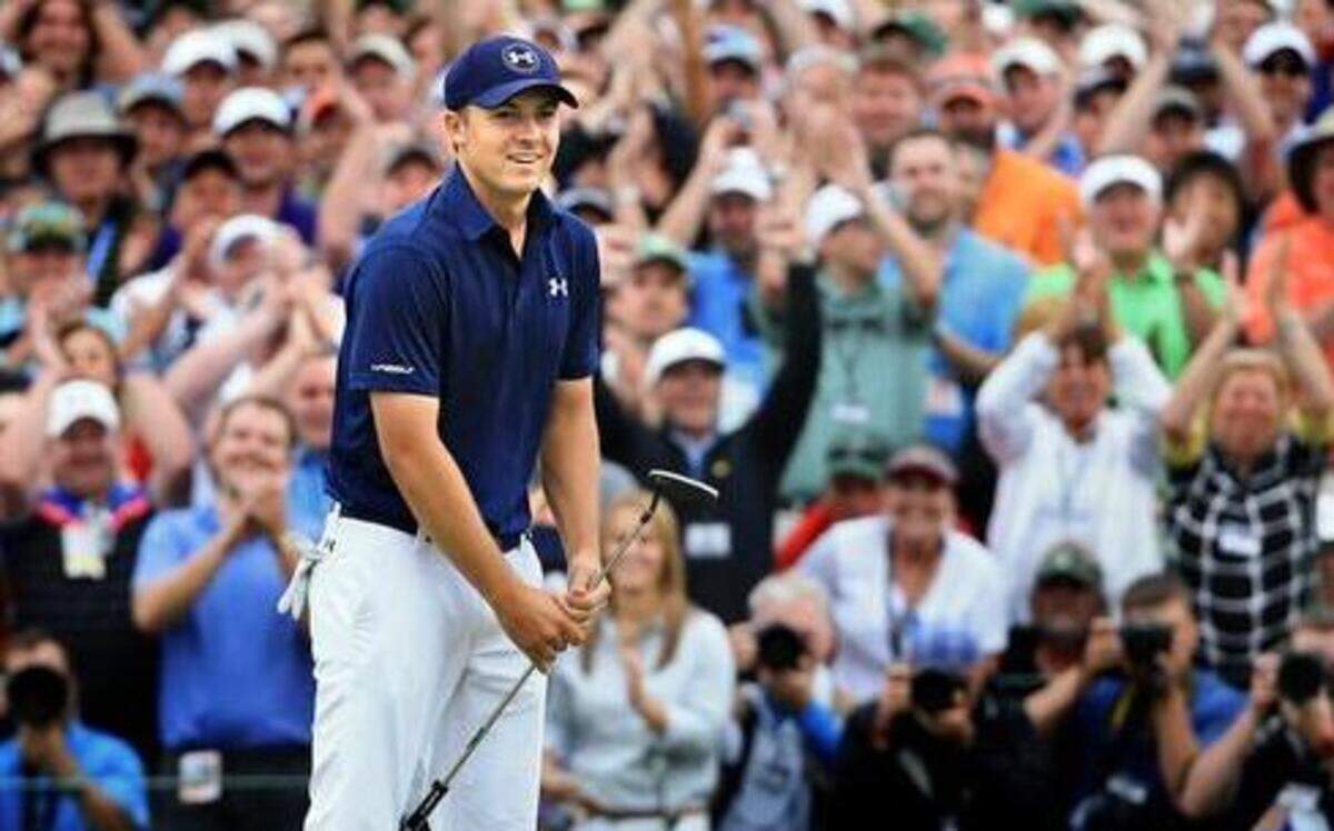 
Jordan Spieth reacts on the 18th green after his four-stroke victory at the 2015 Masters Tournament at Augusta National Golf Club. 
